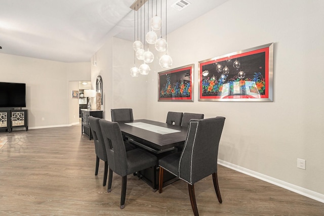 23722 Willow Haven Dr, Spring, TX 77389 - dining space featuring wood finished floors, baseboards, and a chandelier