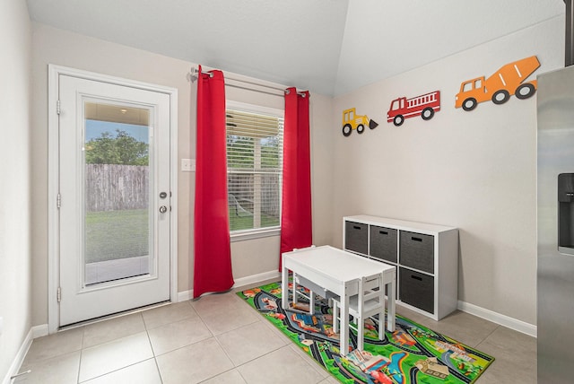 23722 Willow Haven Dr, Spring, TX 77389 - rec room with lofted ceiling, light tile patterned floors, and baseboards