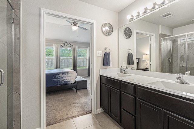 23722 Willow Haven Dr, Spring, TX 77389 - full bathroom featuring connected bathroom, double vanity, a shower stall, and tile patterned flooring