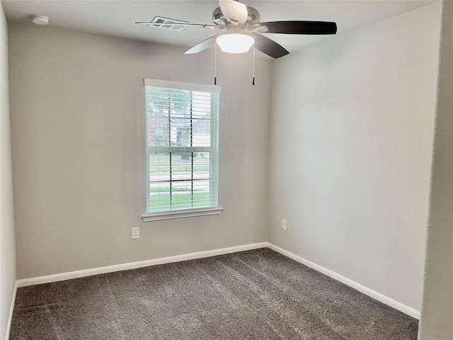 23722 Willow Haven Dr, Spring, TX 77389 - empty room with ceiling fan, a smoke detector, dark colored carpet, and baseboards