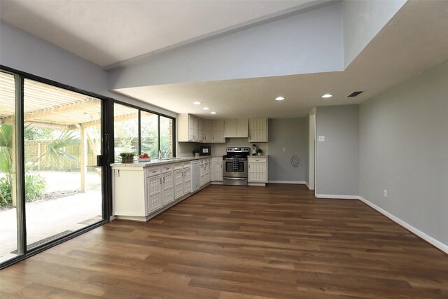 3903 Coltwood Dr, Spring, TX 77388 - kitchen with white dishwasher, stainless steel electric range oven, light countertops, baseboards, and dark wood-style floors