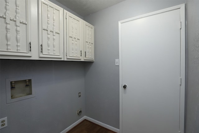 3903 Coltwood Dr, Spring, TX 77388 - laundry area featuring cabinet space, hookup for an electric dryer, baseboards, dark wood-style flooring, and washer hookup