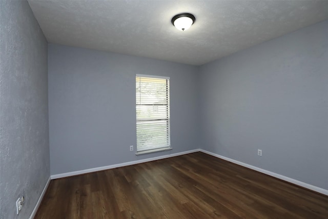 3903 Coltwood Dr, Spring, TX 77388 - unfurnished room with dark wood finished floors and baseboards