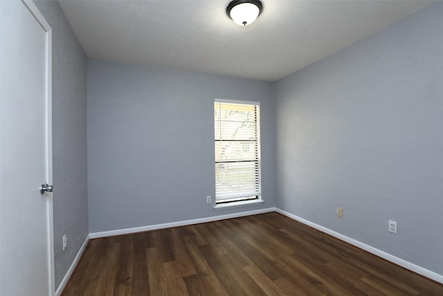 3903 Coltwood Dr, Spring, TX 77388 - spare room featuring dark wood-style floors and baseboards