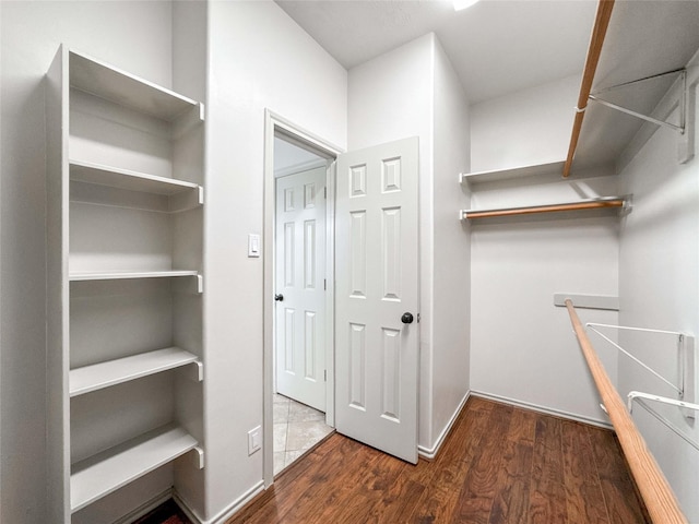 15319 Ochre Leaf Trl, Cypress, TX 77433 - walk in closet with wood finished floors