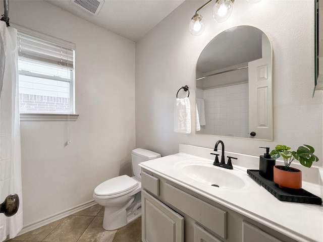 15319 Ochre Leaf Trl, Cypress, TX 77433 - bathroom featuring toilet, vanity, tile patterned flooring, a shower with shower curtain, and baseboards