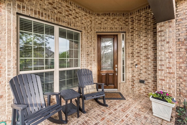27121 Holtwood Grove Rd, Magnolia, TX 77354 - view of exterior entry featuring brick siding