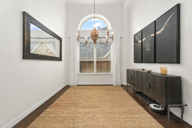 27121 Holtwood Grove Rd, Magnolia, TX 77354 - unfurnished dining area featuring a chandelier, dark wood-type flooring, and baseboards