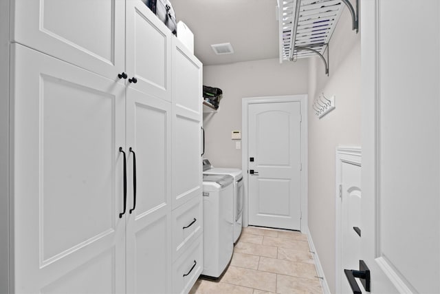 27121 Holtwood Grove Rd, Magnolia, TX 77354 - laundry area with separate washer and dryer and light tile patterned floors