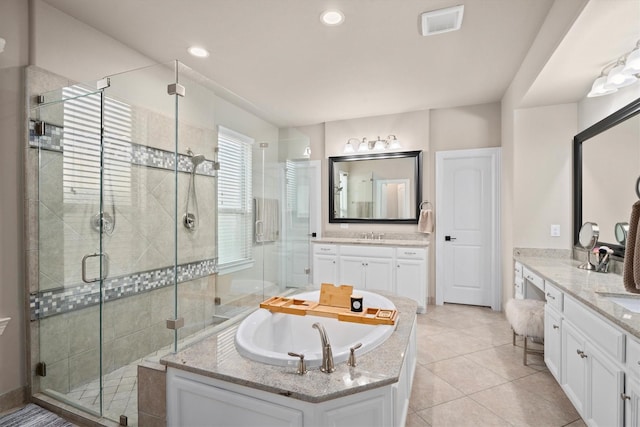 27121 Holtwood Grove Rd, Magnolia, TX 77354 - full bathroom featuring a stall shower, a garden tub, vanity, tile patterned flooring, and recessed lighting