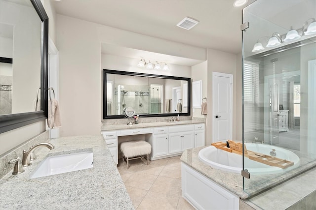 27121 Holtwood Grove Rd, Magnolia, TX 77354 - bathroom featuring a shower stall, two vanities, a garden tub, tile patterned floors, and healthy amount of natural light
