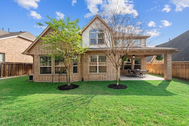 27121 Holtwood Grove Rd, Magnolia, TX 77354 - rear view of house featuring a ceiling fan, brick siding, and a patio area