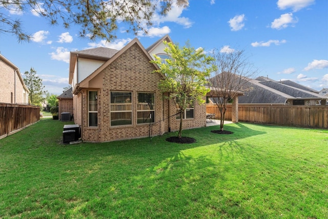27121 Holtwood Grove Rd, Magnolia, TX 77354 - rear view of property featuring brick siding and central air condition unit