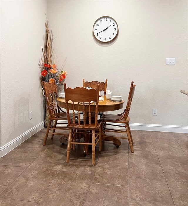 115 Carriage Ct, Magnolia, TX 77354 - dining space with baseboards and tile patterned flooring