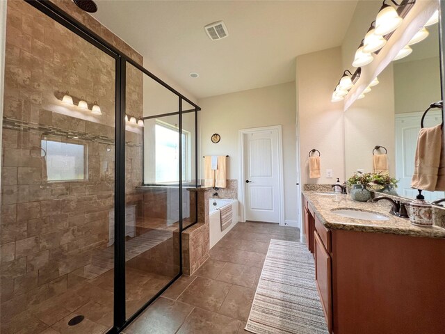 115 Carriage Ct, Magnolia, TX 77354 - bathroom with a bath, a shower stall, double vanity, and tile patterned flooring