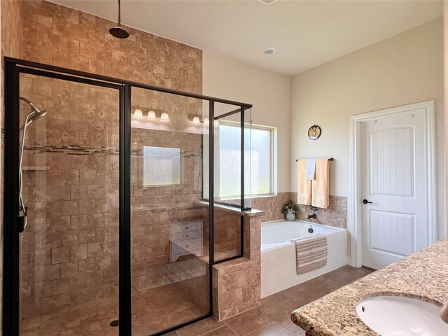 115 Carriage Ct, Magnolia, TX 77354 - full bath with a shower stall, a garden tub, double vanity, and tile patterned flooring