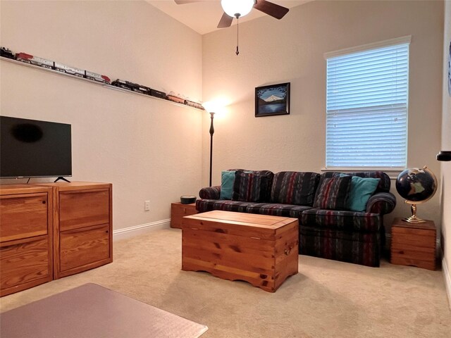 115 Carriage Ct, Magnolia, TX 77354 - living area with light carpet, ceiling fan, and baseboards