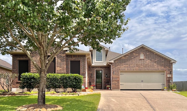 115 Carriage Ct, Magnolia, TX 77354 - view of front of house featuring brick siding, concrete driveway, an attached garage, and a front yard