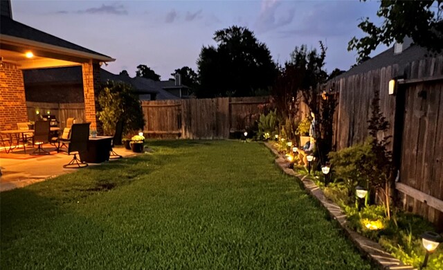 115 Carriage Ct, Magnolia, TX 77354 - view of yard with a patio area and an outdoor fire pit