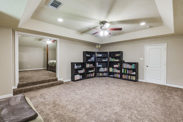507 Oaks Grande Rd, Baytown, TX 77523 - sitting room with ceiling fan, a tray ceiling, carpet, a textured ceiling, and recessed lighting