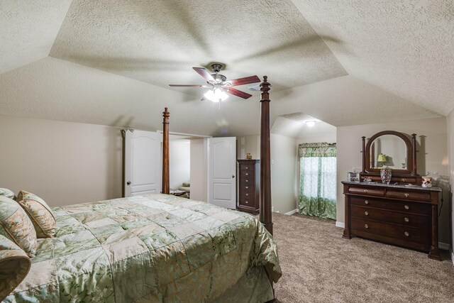 507 Oaks Grande Rd, Baytown, TX 77523 - bedroom with vaulted ceiling, carpet, a textured ceiling, and ceiling fan