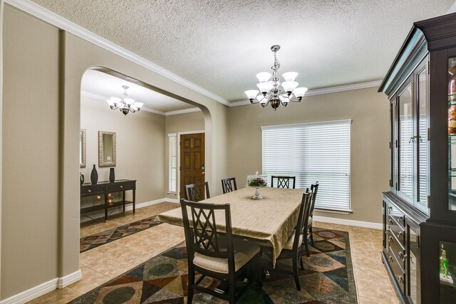 507 Oaks Grande Rd, Baytown, TX 77523 - dining space with arched walkways, a chandelier, ornamental molding, light tile patterned floors, and a textured ceiling