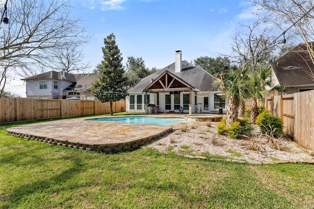 3106 Five Oaks Dr, Missouri City, TX 77459 - view of swimming pool with a fenced backyard, a patio area, and a pool with connected hot tub