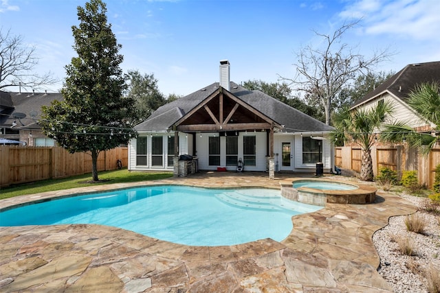 3106 Five Oaks Dr, Missouri City, TX 77459 - view of swimming pool featuring a patio, a fenced backyard, and a pool with connected hot tub