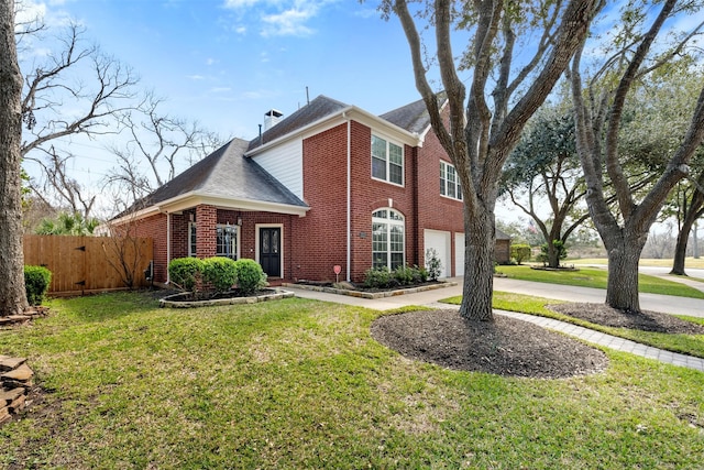 3106 Five Oaks Dr, Missouri City, TX 77459 - view of front of home with brick siding, an attached garage, a shingled roof, and driveway