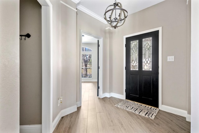 3106 Five Oaks Dr, Missouri City, TX 77459 - entrance foyer featuring a chandelier, wood finished floors, and crown molding