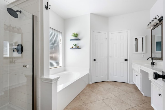3106 Five Oaks Dr, Missouri City, TX 77459 - full bathroom featuring vanity, a stall shower, a garden tub, and tile patterned flooring