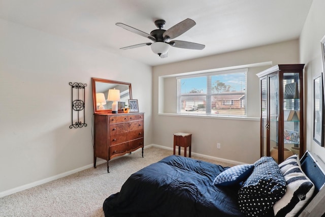 10711 Kirkside Dr, Houston, TX 77096 - carpeted bedroom with baseboards and a ceiling fan