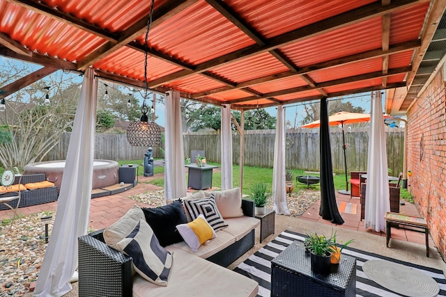 10711 Kirkside Dr, Houston, TX 77096 - fenced backyard with outdoor lounge area, a hot tub, and a patio area