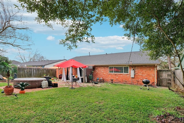 10711 Kirkside Dr, Houston, TX 77096 - rear view of house featuring a hot tub, brick siding, and roof with shingles