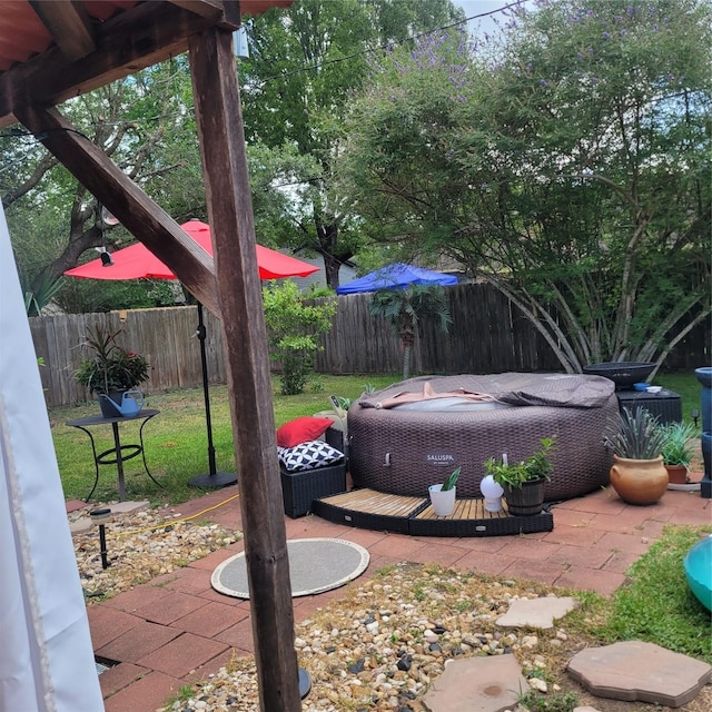 10711 Kirkside Dr, Houston, TX 77096 - fenced backyard featuring a hot tub and a patio