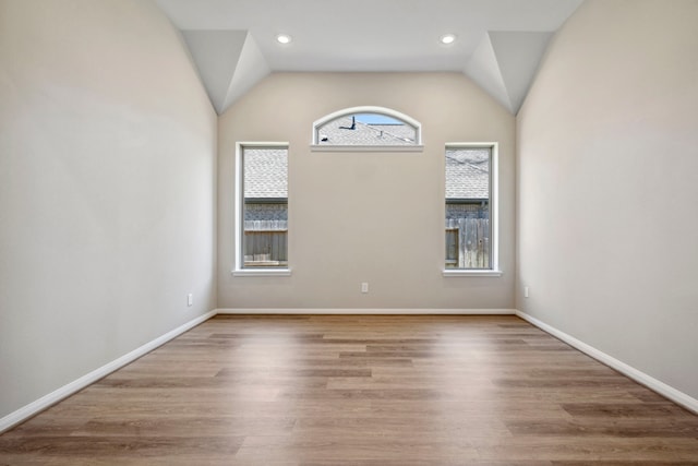 7918 Summit Trail Ln, Porter, TX 77365 - unfurnished room with vaulted ceiling, wood finished floors, baseboards, and recessed lighting