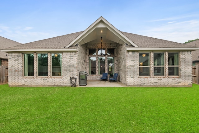 7918 Summit Trail Ln, Porter, TX 77365 - rear view of property featuring brick siding, a patio, and a shingled roof