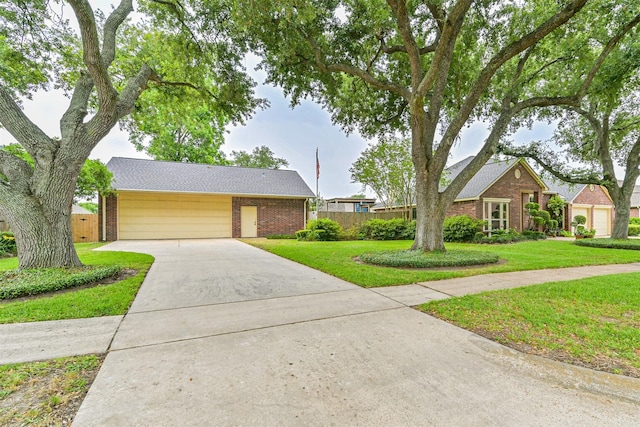 610 Bayou Bend Dr, Deer Park, TX 77536 - view of front of home with brick siding, driveway, and a garage