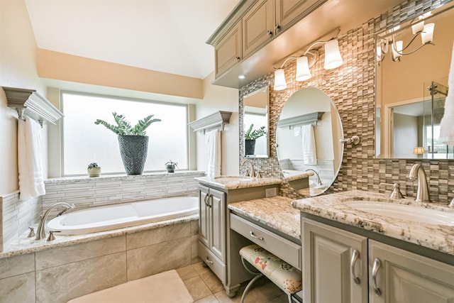 610 Bayou Bend Dr, Deer Park, TX 77536 - bathroom with plenty of natural light, a garden tub, tile patterned floors, and vanity