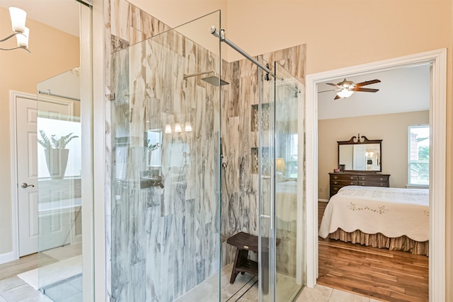 610 Bayou Bend Dr, Deer Park, TX 77536 - ensuite bathroom featuring a marble finish shower, a ceiling fan, and tile patterned flooring