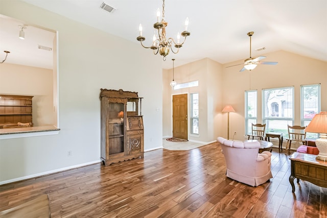 610 Bayou Bend Dr, Deer Park, TX 77536 - living room featuring wood finished floors, ceiling fan, a chandelier, baseboards, and high vaulted ceiling