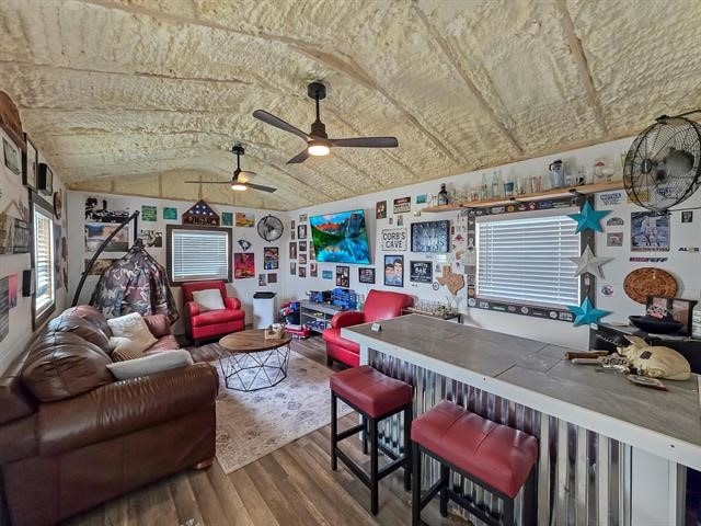 14845 Norma Jane Ln, Beaumont, TX 77713 - living room featuring wood finished floors, lofted ceiling, and a ceiling fan