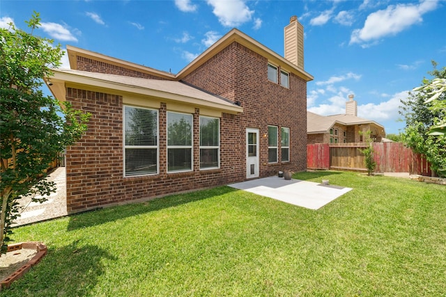 20838 Morgan Knoll Ln, Katy, TX 77449 - rear view of property featuring brick siding, a patio, and a chimney
