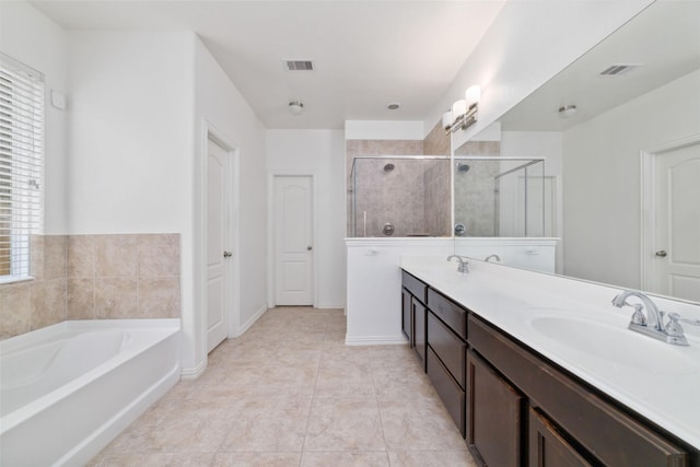 20838 Morgan Knoll Ln, Katy, TX 77449 - full bath with a bath, double vanity, a stall shower, and tile patterned flooring