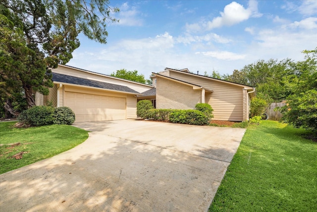 2719 Williams Grant St, Sugar Land, TX 77479 - mid-century modern home featuring concrete driveway and an attached garage