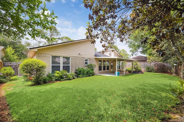 2719 Williams Grant St, Sugar Land, TX 77479 - rear view of property featuring a patio area and brick siding