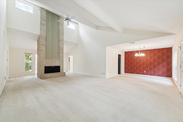 2719 Williams Grant St, Sugar Land, TX 77479 - unfurnished living room with a chandelier, high vaulted ceiling, an accent wall, carpet, and healthy amount of natural light