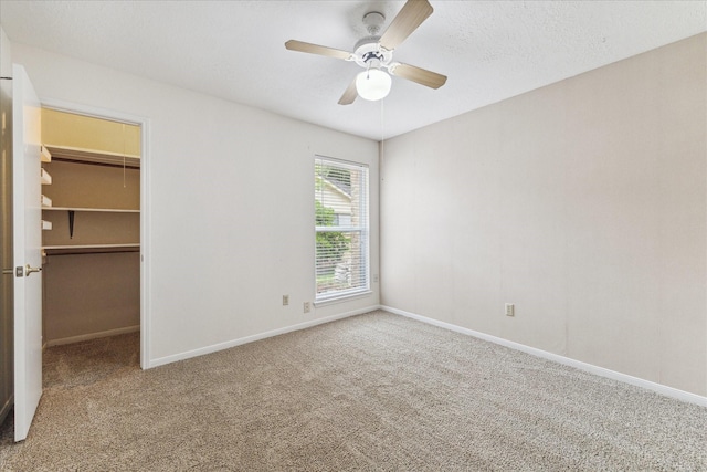 2719 Williams Grant St, Sugar Land, TX 77479 - unfurnished bedroom featuring carpet flooring, a spacious closet, baseboards, a closet, and a ceiling fan
