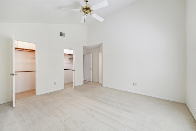 2719 Williams Grant St, Sugar Land, TX 77479 - unfurnished bedroom with light colored carpet, high vaulted ceiling, a walk in closet, baseboards, and a ceiling fan