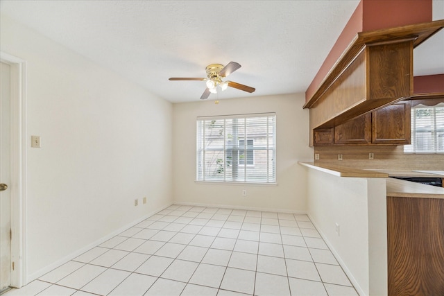 2719 Williams Grant St, Sugar Land, TX 77479 - unfurnished dining area featuring a ceiling fan, light tile patterned floors, and baseboards